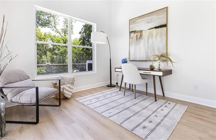 FIRST FLOOR Office or bedroom  with hardwood / wood-style flooring and a wealth of natural light