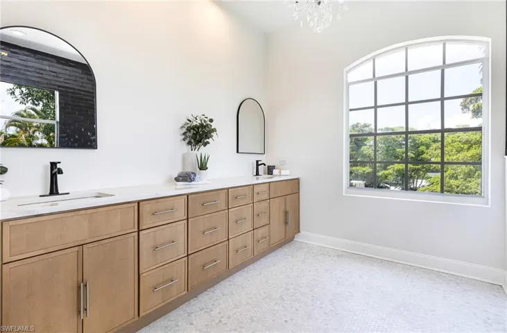 Spacious bathroom with his and hers sinks and ample counter space for all