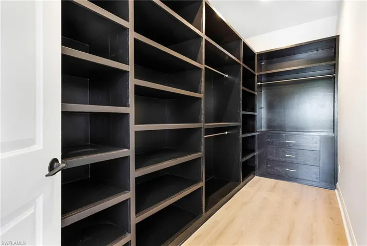 HIS:Functional, modern walk in closet perfect for any man.
