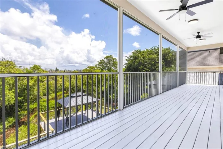 Second floor deck spans across the entire back of the house.