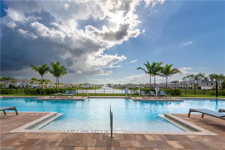 Community pool featuring a patio