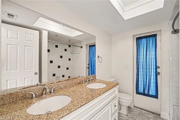 Pool bath with newer cabinets, granite countertops
