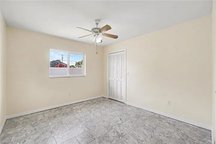 Walk in closet in generous sized bedroom
