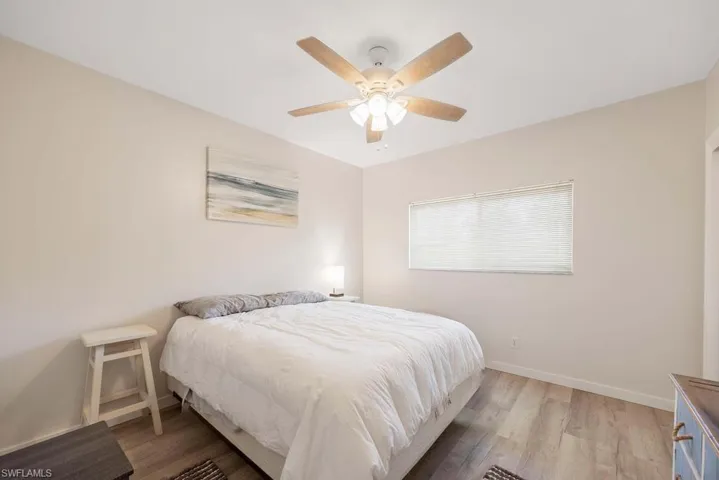 Bedroom featuring hardwood / wood-style flooring and ceiling fan