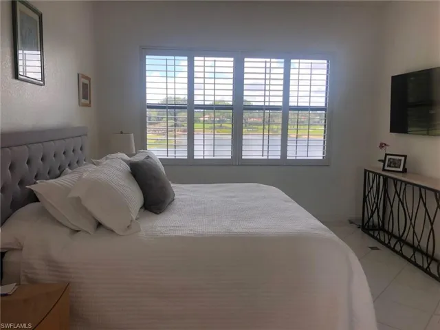 Water & golf course views from bedroom