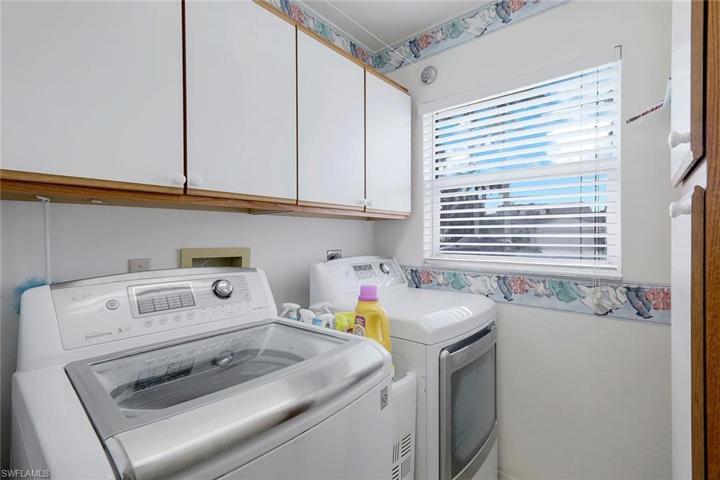 Laundry room with plenty of additional storage.