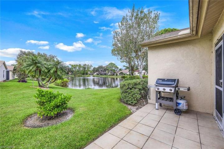 More patio space in the rear of the home, perfect for grilling or sunbathing. Notice the lake view!