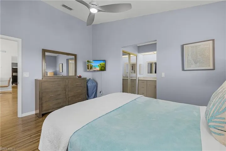 Bedroom with wood finished floors and a ceiling fan