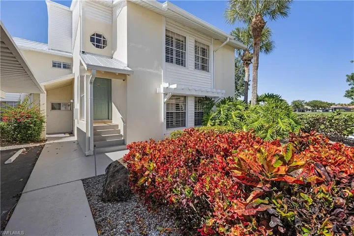 Doorway to property with stucco siding