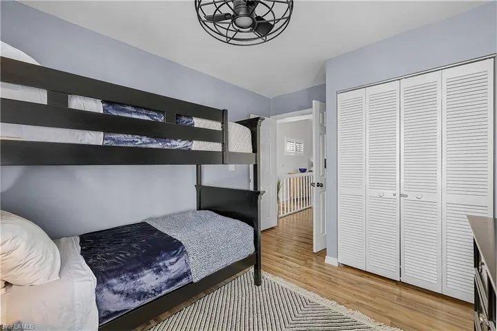 Bedroom featuring a closet and light wood-style flooring