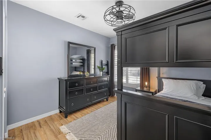 Bedroom featuring baseboards and light wood-type flooring
