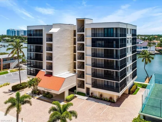 Front view of condominium building with bay