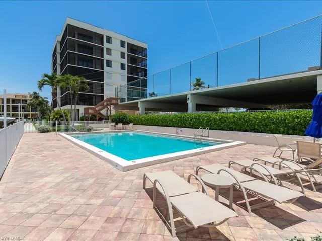 Community pool with a patio area