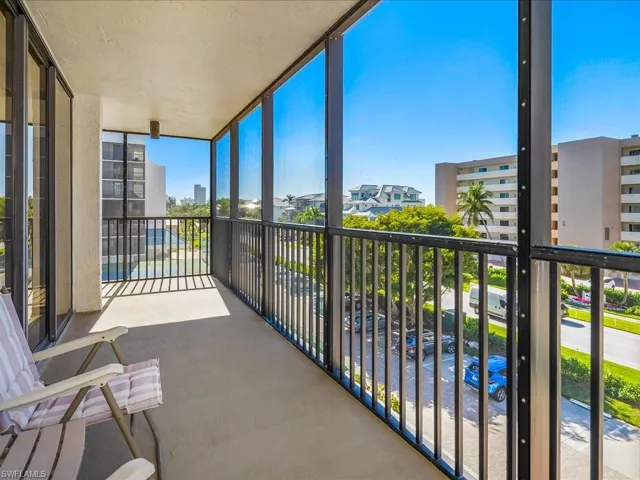 Balcony with a sunroom facing west with view of the Gulf of Mexico