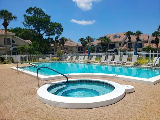 View of pool featuring a hot tub
