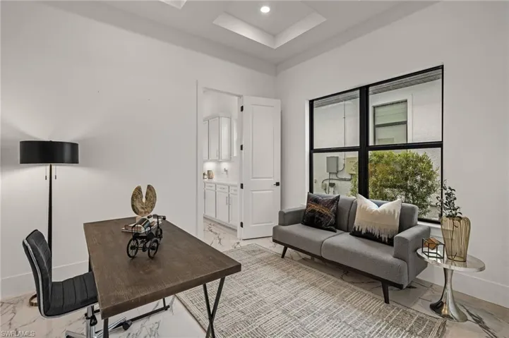 Office space with marble finish floor, baseboards, and recessed lighting