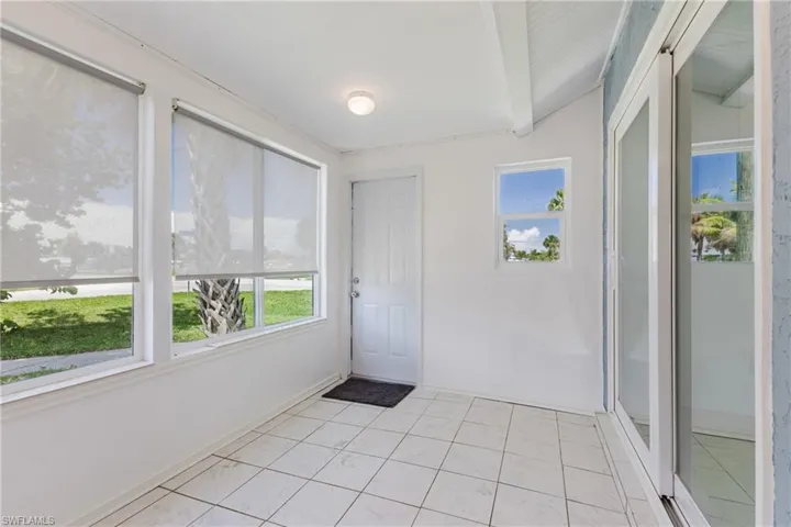Unfurnished sunroom with healthy amount of natural light