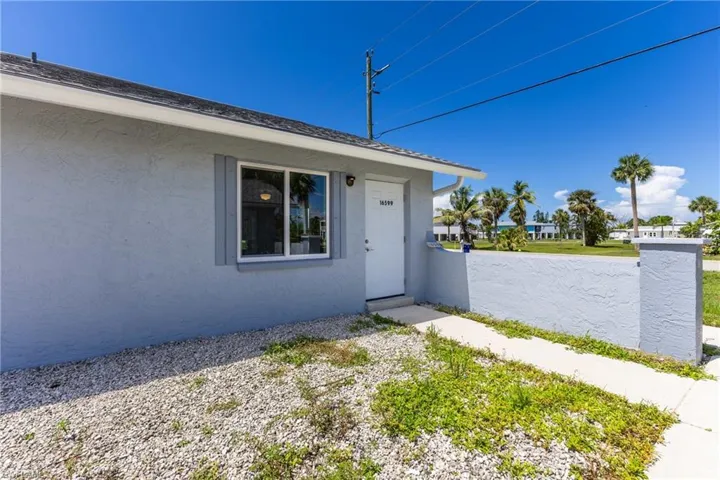 Doorway to property with stucco siding