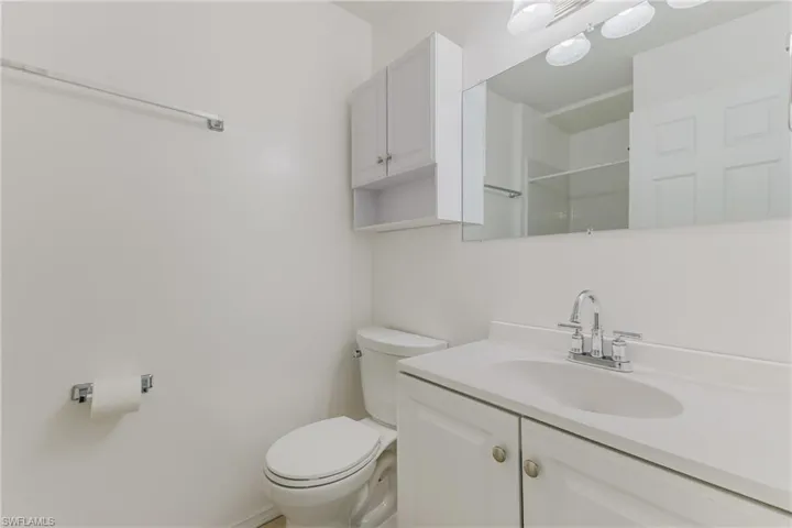 Bathroom featuring vanity and a shower