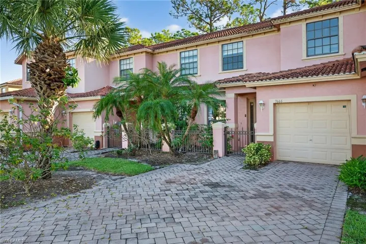 Mediterranean / spanish-style house featuring stucco siding, a garage, driveway, and a tiled roof