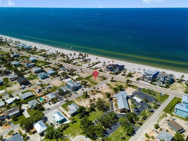 Aerial view with a water view and a beach view