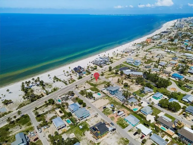 Bird's eye view featuring a beach view and a water view