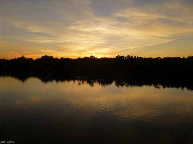 Water view with sunset over mangroves.
