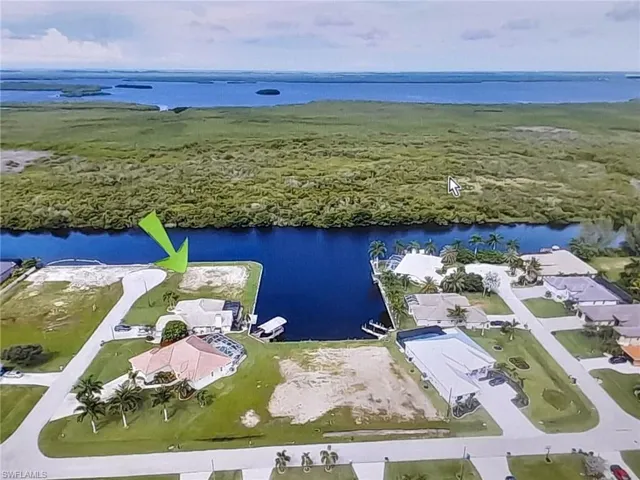 Bird's eye view of property, looking West over mangroves.