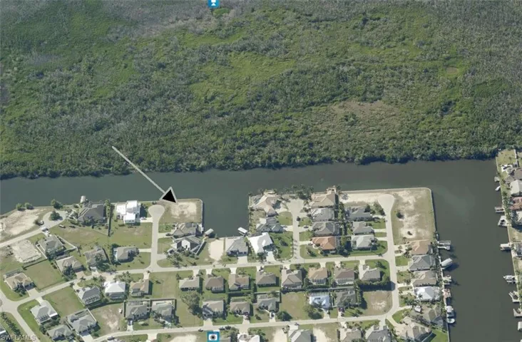Aerial view of property and surrounding area, looking West.