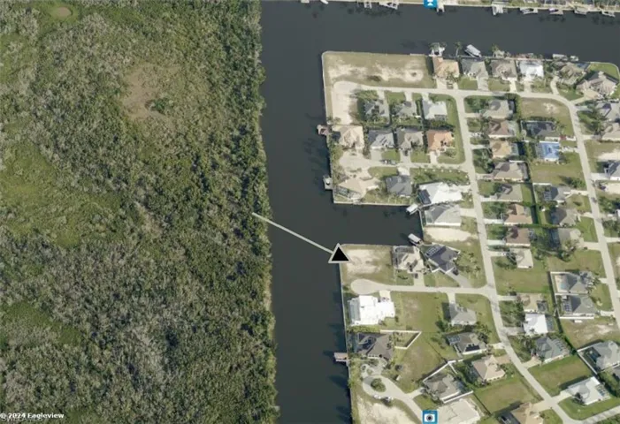 Aerial view of property and surrounding area, looking North.