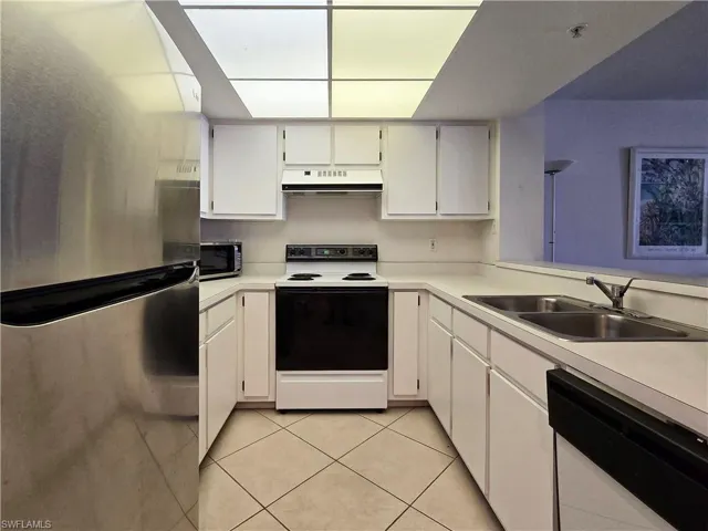 Kitchen featuring  white cabinets