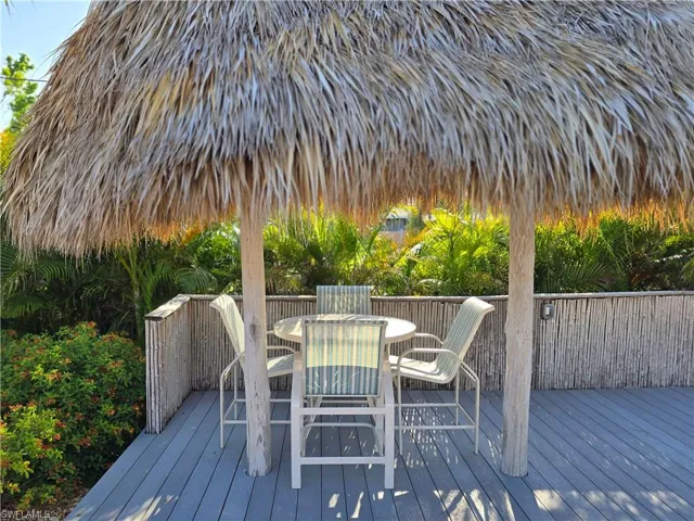 Wooden terrace with outdoor sitting area at the pool