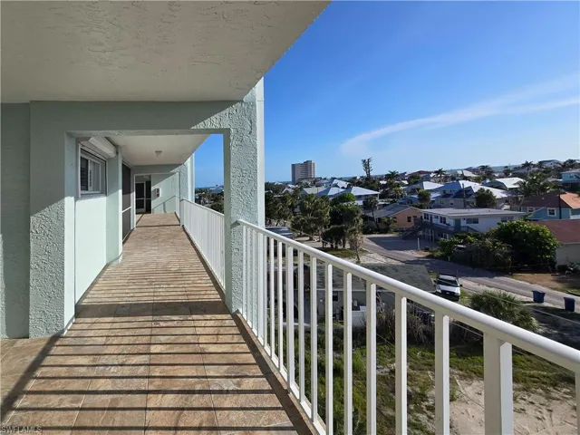 Balcony featuring a west view