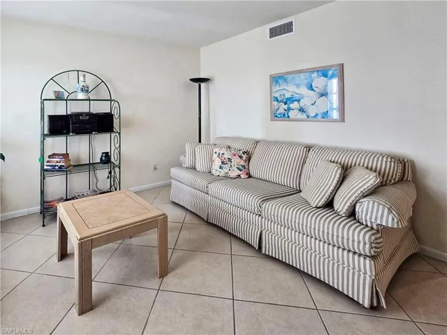 DenDen, featuring light tile patterned floors and baseboards