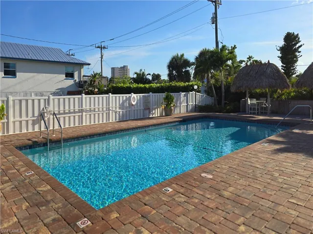 View of swimming pool with a patio area