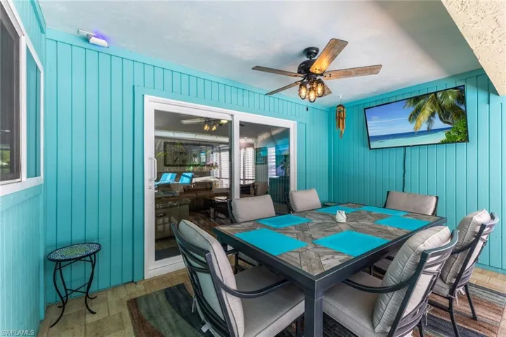 View of patio featuring a ceiling fan and outdoor dining space