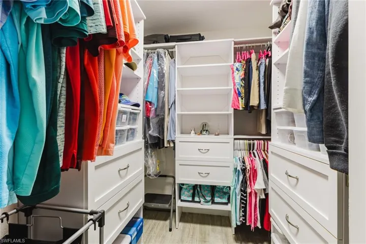Walk in closet featuring light wood-style flooring