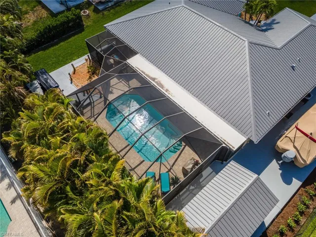 View of subject property with a pool