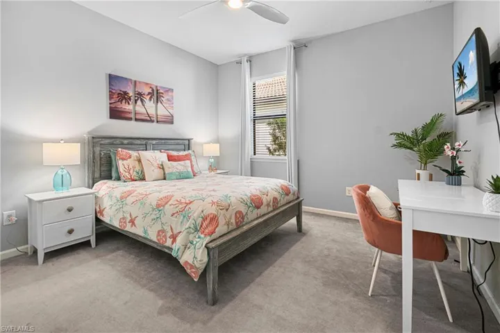 Bedroom featuring ceiling fan and carpet flooring