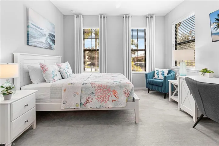 Bedroom with light colored carpet