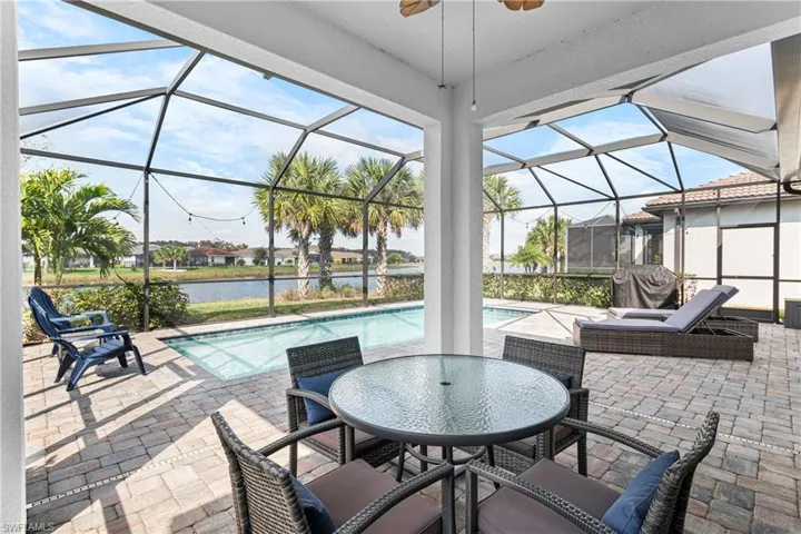 View of Covered Lanai with ceiling fan, a water view, and Screen enclosure