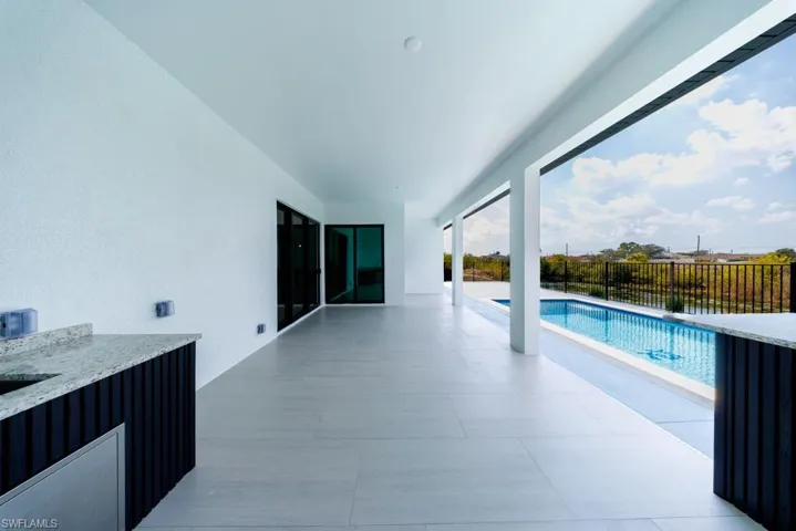 View of swimming pool with patio surround