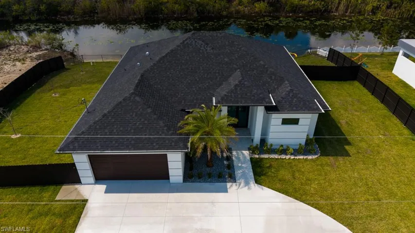 View from above of property with a nearby body of water