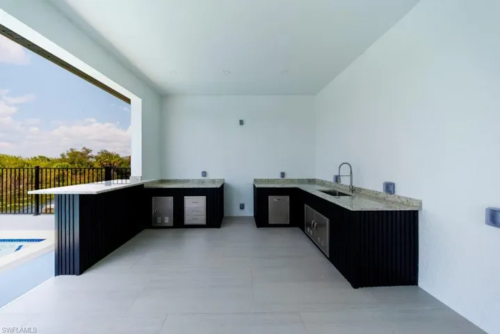 View of patio featuring area for grilling
