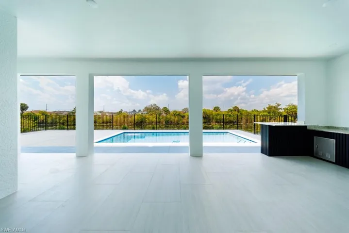 View of swimming pool featuring a fenced backyard