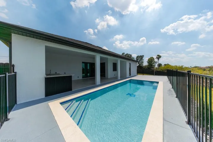 View of pool featuring patio surround