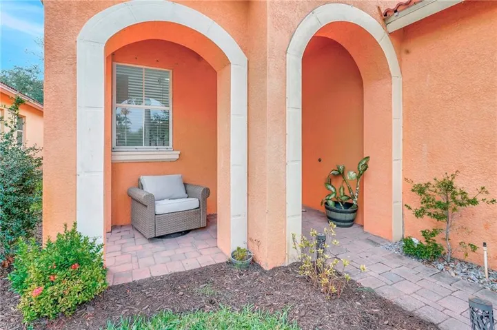 Doorway to property with a patio area