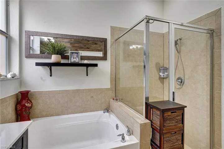 Bathroom with plus walk in shower and vanity