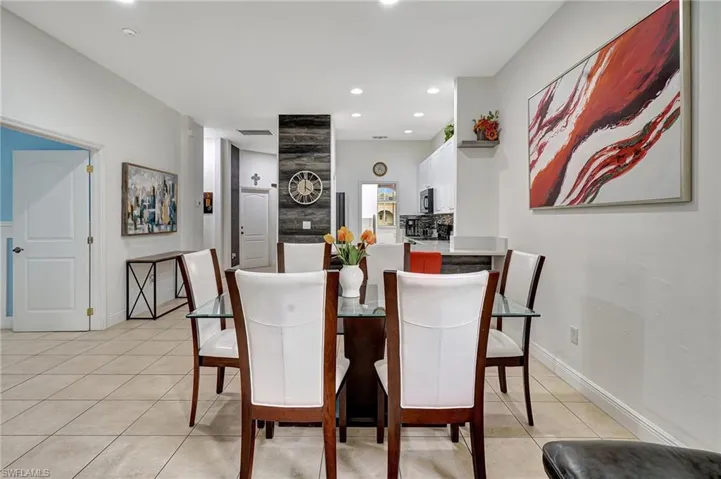 Dining room featuring light tile patterned flooring