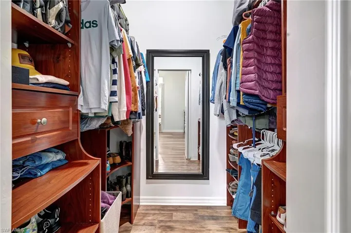 Walk in closet featuring wood-type flooring